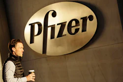 In this Monday, Nov. 23, 2015, file photo, a man enters Pfizer's world headquarters, in New York. Pfizer is buying biopharmaceutical company Medivation in a deal valued at about $14 billion. Medivation Inc.’s stock soared more than 19 percent in Monday, Aug. 22, 2016 premarket trading.