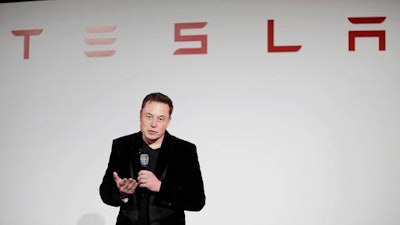 In this Tuesday, Sept. 29, 2015, file photo, Elon Musk, CEO of Tesla Motors Inc., talks during a news conference at the company's headquarters in Fremont, Calif. On Tuesday, Aug. 23, 2016, Tesla Motors said a new version of the Model S electric car is now the quickest production car in the world from zero to 60 miles per hour. The company says the Model S P100D sedan can go from stopped to 60 in 2.5 seconds.