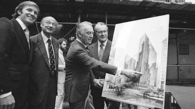 In this June 28, 1978, file photo, then New York Gov Hugh Carey points to an artists' conception of the new New York Hyatt Hotel/Convention facility that will be build on the site of the former Commordore Hotel, in New York. At the launching ceremony are, from left: Donald Trump, son of the city developer Fred C. Trump; Mayor Ed Koch of New York; Carey; and Robert T. Dormer, executive vice president of the Urban Development Corp.