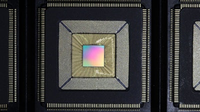 Unlidded Princeton Piton Processor is shown. Multicolored die is wirebonded inside chip package.