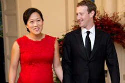 In this Friday, Sept. 25, 2015, file photo, Facebook Chairman and CEO Mark Zuckerberg and his wife, Priscilla Chan, arrive for a State Dinner in honor of Chinese President Xi Jinping, in the East Room of the White House in Washington. Despite no national law, paid family leave benefits are rising in some business sectors and regions thanks to company policy and laws. A majority of Americans over 40 support paid leave to care for family. Highly visible executives, like Zuckerberg, have spoken out in favor of paid family leave laws. He announced with a status update on Facebook that he was taking two months of parental leave to help care for his new daughter. Facebook offers 16 weeks of paid leave to new mothers and fathers.