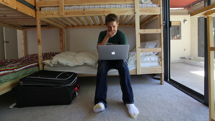 Phillip Cohen in the bedroom of a hacker hostel in Menlo Park, CA.