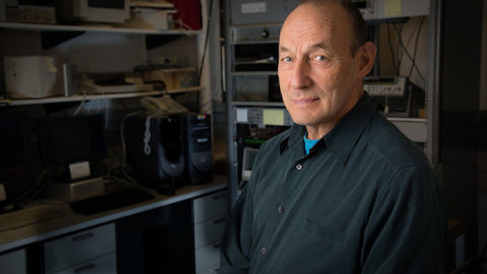 Mathematician Marc Weiss in the NIST Boulder laboratory that controls an experimental demonstration of time transfer over commercial telecommunications networks. In the experiment, equipment in this room locks onto NIST’s official version of international time, transfers time signals back and forth between NIST and U.S. Naval Observatory time services in Colorado Springs, and measures system time transfer accuracy.