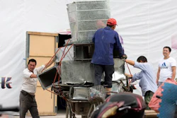 Workers remove air ducts made from aluminum sheet metal in Beijing, China. China’s leaders are promising to rein in aluminum production that is flooding global markets and threatening jobs in the United States and Europe, but its producers have ambitious plans to expand.