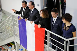 Michel Catalano (L), the owner of the print works, French President Francois Hollande (2ndL) and the Catalano family attend the inauguration of the rebuilt groupe Michel Catalano printing house where brothers Kouachi, Charlie Hebdo's attackers, were trapped and killed, in Dammartin-en-Goele, France.