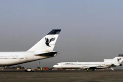 In this March 2, 2008 file photo, two passenger planes of Iran's national air carrier, Iran Air, are parked at the Mehrabad Airport in Tehran, Iran. Airbus announced Wednesday, Sept. 21, 2016, that the U.S. government has granted it a license allowing it to sell the first 17 planes involved in a landmark deal with Iran. Most Iranian planes were purchased before the 1979 Islamic Revolution that ousted Shah Mohammad Reza Pahlavi and brought Islamists to power.