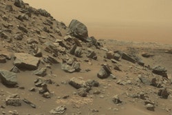 This view from the Mast Camera (Mastcam) in NASA's Curiosity Mars rover shows a sloping hillside within the Murray Buttes region on lower Mount Sharp. The rim of Gale Crater, where the rover has been active since landing in 2012, is visible in the distance. The image was taken on Sept. 8, 2016, during the 1454th Martian day, or sol, of Curiosity's work on Mars.