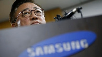 Koh Dong-jin, president of Samsung Electronics' mobile business, speaks at a news conference in Seoul, South Korea, Friday, Sept. 2, 2016. Samsung suspended sales of its Galaxy Note 7 smartphone on Friday, just two weeks after the flagship phone's launch, after finding batteries of some of the gadgets exploded while they were charging. Koh said customers who already bought Note 7s will be able to swap them for new smartphones, regardless of when they purchased them.