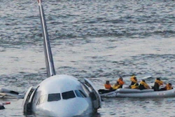 In this Jan. 15, 2009 file photo, passengers in an inflatable raft move away from an Airbus 320 US Airways aircraft that has gone down in the Hudson River in New York. More than seven years after an airline captain saved 155 lives by ditching his crippled airliner in the Hudson River, now the basis of a new movie, most of the safety recommendations stemming from the accident have yet to be followed.