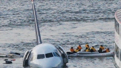 In this Jan. 15, 2009 file photo, passengers in an inflatable raft move away from an Airbus 320 US Airways aircraft that has gone down in the Hudson River in New York. More than seven years after an airline captain saved 155 lives by ditching his crippled airliner in the Hudson River, now the basis of a new movie, most of the safety recommendations stemming from the accident have yet to be followed.