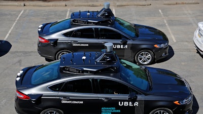 A group of self-driving Uber vehicles at Uber's Advanced Technologies Center in Pittsburgh. Starting September 14 dozens of self-driving Ford Fusions will pick up riders who opted into a test program with Uber. While the vehicles are loaded with features that allow them to navigate on their own, an Uber engineer will sit in the driver’s seat and seize control if things go awry.