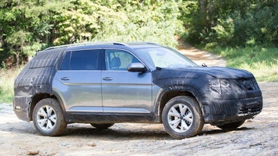 A camouflaged prototype of Volkswagen's new midsized SUV is seen on an off road trail at Prentice Cooper State Forest near Chattanooga, Tenn., Monday, Aug. 29, 2016. The German automaker plans to begin production of the new model at it Chattanooga plant later this year.