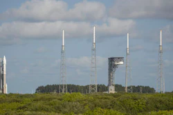 In this Wednesday, Sept. 7, 2016 photo, a United Launch Alliance Atlas V rocket, left, carrying NASA's OSIRIS-REx spacecraft, sits at its launchpad at Cape Canaveral Air Force Station in Florida. The mission, scheduled to launch on Thursday, Sept. 8, is the first U.S. attempt to reach an asteroid return a sample to Earth for study.