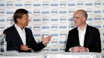 Hakan Samuelsson, left, MD Volvo Cars Group, and Jan Carlson, MD Autoliv, speak during a press conference in Stockholm, Sweden, Tuesday Sept. 6, 2016. Chinese-owned Volvo Cars and Sweden-based automotive safety group Autoliv say they are creating a jointly-owned company to develop autonomous driving software for Volvo cars.