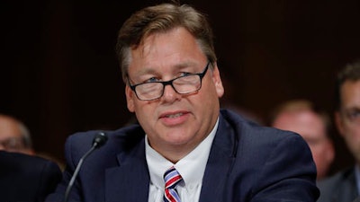 Bayer CropScience North America President and CEO Jim Blome testifies on Capitol Hill in Washington, Tuesday, Sept. 20, 2016, before the Judiciary Committee hearing on a proposed $66 billion merger of American seed and weed-killer company Monsanto and German medicine and farm chemical maker Bayer.