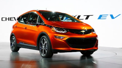 In this Monday, Jan. 11, 2016, file photo, the Chevrolet Bolt EV debuts at the North American International Auto Show in Detroit. The Chevrolet Bolt, General Motors’ Tesla-fighting electric hatchback for the masses, will be able to go 238 miles on a single charge. The car beats the base rear-wheel-drive Tesla Model S, which can go 210 miles per charge but costs about $28,500 more.