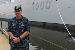 Capt. James Kirk, skipper of the future USS Zumwalt, stands in front of the destroyer at Bath Iron Works on Tuesday, Sept. 6, 2016, in Bath, Maine. The ship is due to depart the shipyard on Wednesday to be commissioned in Baltimore.