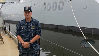 Capt. James Kirk, skipper of the future USS Zumwalt, stands in front of the destroyer at Bath Iron Works on Tuesday, Sept. 6, 2016, in Bath, Maine. The ship is due to depart the shipyard on Wednesday to be commissioned in Baltimore.