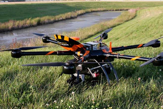 This Aug. 29, 2016, file photo provided by Sharper Shape and SkySkopes shows a Sharper A6 drone before a test to fly over power lines in eastern North Dakota near Blanchard. The drone is specially designed for utility asset inspections. The drone is being tested as part of a project by Xcel Energy to see of unmanned aircraft can help crews restore power to areas hit by natural disasters. Officials with the company hope to be flying beyond visual line of sight by the end of the year.