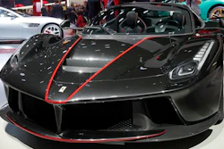 The new Ferrari Aperta is unveiled during the first press day at the Paris Auto Show in Paris, France, Thursday, Sept. 29, 2016. The Paris Auto Show will open its gates to the public from Oct. 1st to 16th.