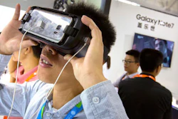 A visitor tries out a Samsung Gear VR headset at a Samsung Electronics display booth during an electronics expo in Beijing, Wednesday, Sept. 21, 2016. Samsung Electronics says its smartphones sold in China don't suffer the same problems as units that caught fire in the United States but Chinese customers complain the company is doing too little to reassure Chinese owners their handsets are safe.