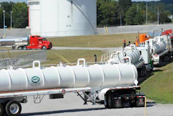 Tanker trucks line up at a Colonial Pipeline Co. facility in Pelham, Ala., near the scene of a 250,000-gallon gasoline spill on Friday, Sept. 16, 2016. The company says spilled gasoline is being taken to the storage facility for storage. Some motorists could pay a little more for gasoline in coming days because of delivery delays.