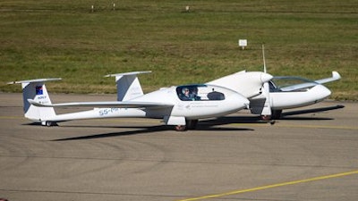The world's first four-seater plane HY4 that uses emission-free hybrid fuel-cells to fly is pictured at the airport in Stuttgart, Germany, Thursday, Sept. 29, 2016. A 10-minute test flight Thursday at the airport in southwestern Germany involved two pilots and two dummy passengers.