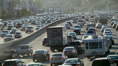 This Sept. 9, 2016 photo shows rush hour traffic moving along the Hollywood Freeway in Los Angeles. California's traffic-locked roads are being considered for their potential to serve a new purpose as clear power producers. After several years studying the technology, the California Energy Commission is soliciting companies and universities to create small-scale field tests to investigate whether the waste energy created by vehicles, and passed onto roads when driving, could be captured and turned into electricity.