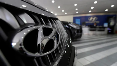 In this April 26, 2016 file photo, the logo of Hyundai Motor Co. is seen on a vehicle displayed at the company's showroom in Seoul, South Korea. Hyundai is recalling about 41,000 small SUVs in the U.S., Thursday, Sept. 15, because a software glitch can stop the vehicles from accelerating. The recall came after pressure from the National Highway Traffic Safety Administration. It covers 2016 Tucson models with seven-speed dual-clutch automatic transmissions made from May 20, 2015 to May 31, 2016.