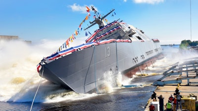 The 13th Littoral Combat Ship, the future USS Wichita, launches sideways into the Menominee River in Marinette, Wisconsin on Sept. 17. Once commissioned, LCS 13 will be the third ship to carry the name of Wichita, Kansas.