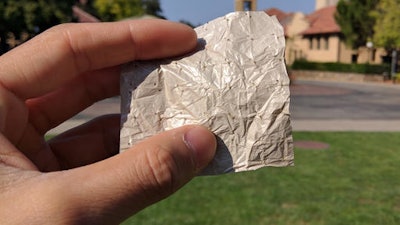 In this photo provided by Yi Cui Group/Stanford University, a small portion of a new nano fabric designed by Stanford engineers that seems to make skin feel cooler than current clothing. Engineers have created cooling clothing designed for a warming world. It’s a fabric that allows your body heat to escape far better than other materials do.