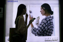 In this Sept. 10, 2016, file photo, a woman walks by an advertisement of the Samsung Electronics Galaxy Note 7 smartphone at a subway station in Seoul, South Korea. South Korea's government asked Samsung Electronics to extend the refund period for its Galaxy Note 7 smartphones that have been subject to an unprecedented global recall.