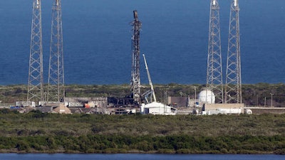 This Thursday, Sept. 8, 2016 file photo shows the damaged SpaceX launch complex 41 at Cape Canaveral Air Force Station in Florida. On Friday, Sept. 23, 2016, SpaceX said a breach in its rocket's helium system may have caused the devastating explosion three weeks ago at Cape Canaveral on Sept. 1.