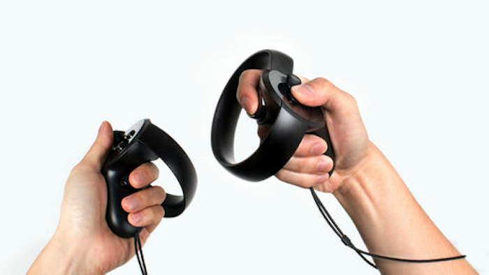 This photo provided by Oculus shows a set of Oculus Touch hand-held controllers, expected to go on sale Dec. 6, 2016. Oculus hopes people find them more comfortable and intuitive to use than traditional video game controllers. Users can make gestures and grasp virtual objects within the simulated worlds projected by Oculus Rift headsets.