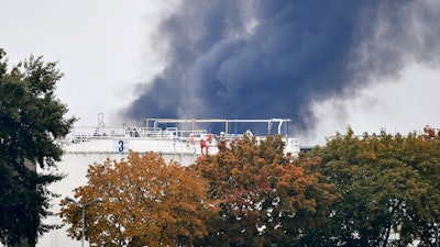 Dark smoke rises from a facility belonging to chemical firm BASF in Ludwigshafen, southwestern Germany, Monday Oct. 17, 2016. The company said that several people were injured in a late-morning explosion.