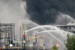 Smoke and fire rise from a facility belonging to chemical firm BASF.