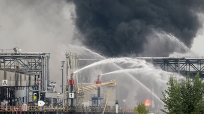 Smoke and fire rise from a facility belonging to chemical firm BASF.