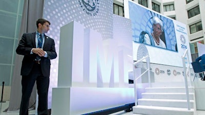 International Monetary Fund (IMF) Managing Director Christine Lagarde is seen on a video screen as she speaks at CNN Debate on the Global Economy during World Bank/IMF Annual Meetings at IMF headquarters in Washington, Thursday, Oct. 6, 2016.