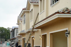 In this file photo, Lennar Corporation townhomes are under construction at Chelsea Place in Tamarac, Fla. The Commerce Department recently reported that U.S. home construction was down in September.