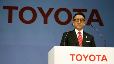 In this file photo, Toyota President and CEO Akio Toyoda speaks during a press conference in Tokyo. Toyota, the world’s top automaker, and Suzuki, a Japanese rival that specializes in tiny vehicles, are partnering. Toyoda said survival depends on such collaborations, and it was not enough for a company to be doing just its own research.