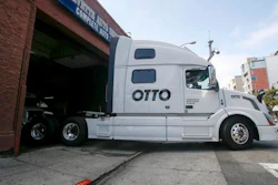 One of Otto's self-driving, big-rig trucks leaves the garage for a test drive during a demonstration at the Otto headquarters in San Francisco. Anheuser-Busch announced that it teamed up with Otto for a 120-plus mile beer delivery that marked the world's first by a self-driving truck.