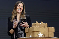 Microsoft's Megan Saunders photographs a sandcastle with her mobile phone as she demonstrates Paint 3D at a Microsoft media event in New York, Wednesday, Oct. 26, 2016.
