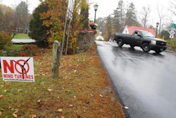A yard sign opposing an industrial wind project sits at the side of the road in Grafton, Vt. Voters in Grafton and Windham are going to cast ballots Nov. 8 on whether to go forward with a plan for 24 turbines in the two communities. Developer Iberdrola Renewables is offering residents of the two towns direct payments if the project is built.