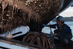 A Sailor scrapes barnacles from the bottom of a rigid-hull inflatable boat aboard the aircraft carrier USS John C. Stennis (CVN 74). When clustered in thick clumps on a vessel's hull, barnacles can slow the ship and increase its fuel consumption. The Office of Naval Research is sponsoring research to develop environmentally friendly hull coatings to fight off barnacles.