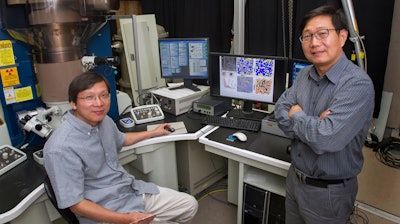 Brookhaven physicist Qiang Li (right) and materials scientist Lijun Wu in an electron microscopy lab in the Condensed Matter Physics and Materials Science Department at Brookhaven Lab.