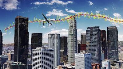 Simulation results for an unmanned drone flying over downtown Los Angeles showing the true trajectory (red line), with GPS navigation only (yellow line), and GPS aided with cellular signals (blue line).