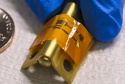 Researchers at the University of Texas at Dallas have developed a flexible, mechanically stable and disposable sensor (orange strip on hinge) that can detect proteins in the blood that signal the onset of a heart attack.