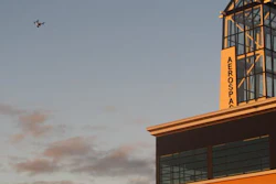 In this Sept. 28, 2016 photo, This drone being flown by University of North Dakota students hovers over an aerospace building in Grand Forks, North Dakota. The flying session was part of the school's first drone business class that is meant to show students what it will take to further their unmanned aircraft careers. One student calls the class a 'game-changer' and another believes it will help him launch a drone business.
