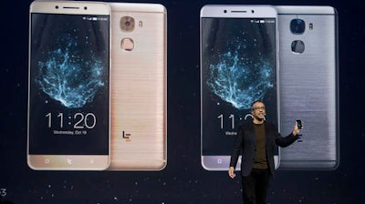Rob Chandhok, LeEco North America chief research and development officer, holds a LePro 3 phone while speaking at an event in San Francisco, Wednesday, Oct. 19, 2016.