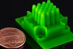 A new microencapsulation technique yields particles of very consistent size, while also affording a high rate of production. The device, pictured here, that produces the spheres was itself manufactured with an affordable commercial 3-D printer.